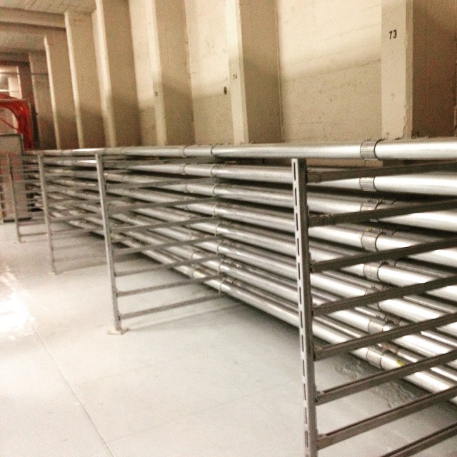 Rows of cable conduit racks in a commercial building riser